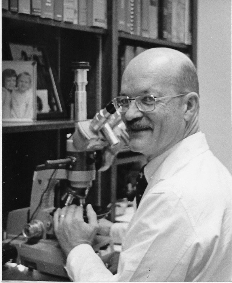 JJKrueger-photo-with-microscope